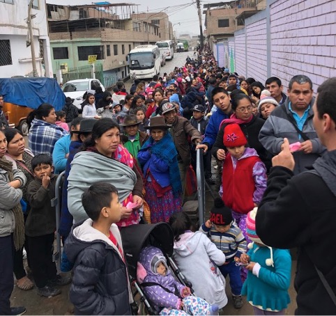 Hundreds of people patiently waiting for medical services