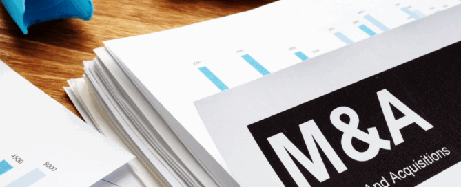 Documents about mergers and acquisitions m&a with a pen.